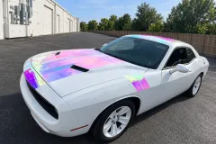 White Dodge Challenger with Iridescent Stripes