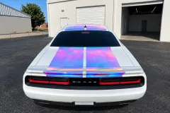 White Dodge Challenger with Iridescent Stripes